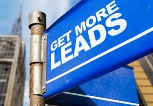 blue sign that says, "Get more leads"