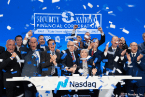 Executives of Security National cheer as they ring the opening bell at Nasdaq